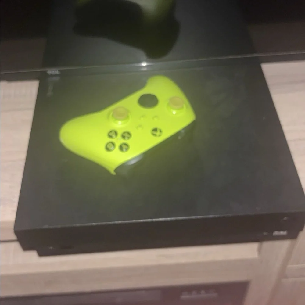 Black Console with Green Controller